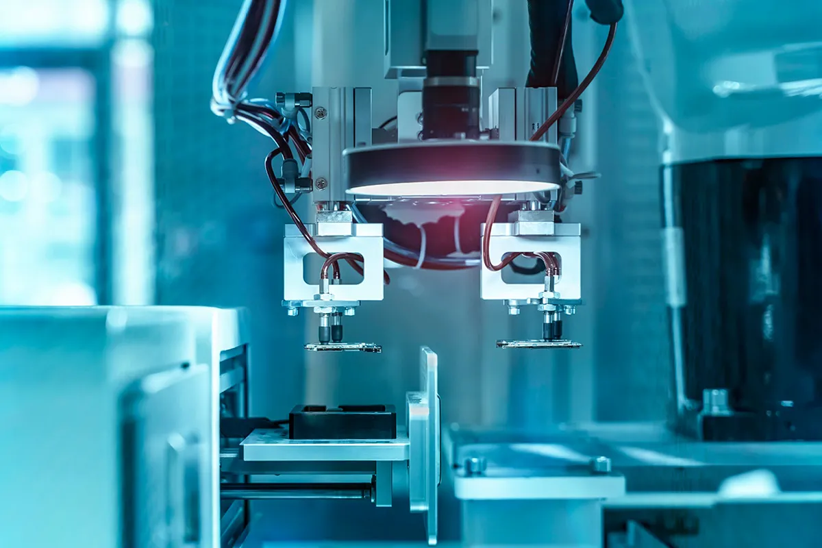 Industrial machinery with shining light on blue background